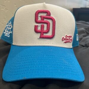 Blue and White Baseball Cap with pink Logo
